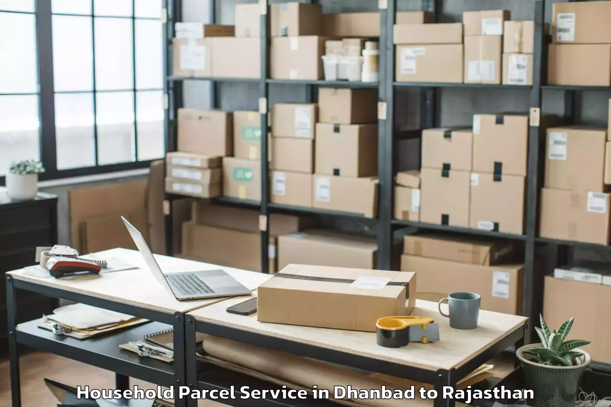 Easy Dhanbad to Bagar Household Parcel Booking